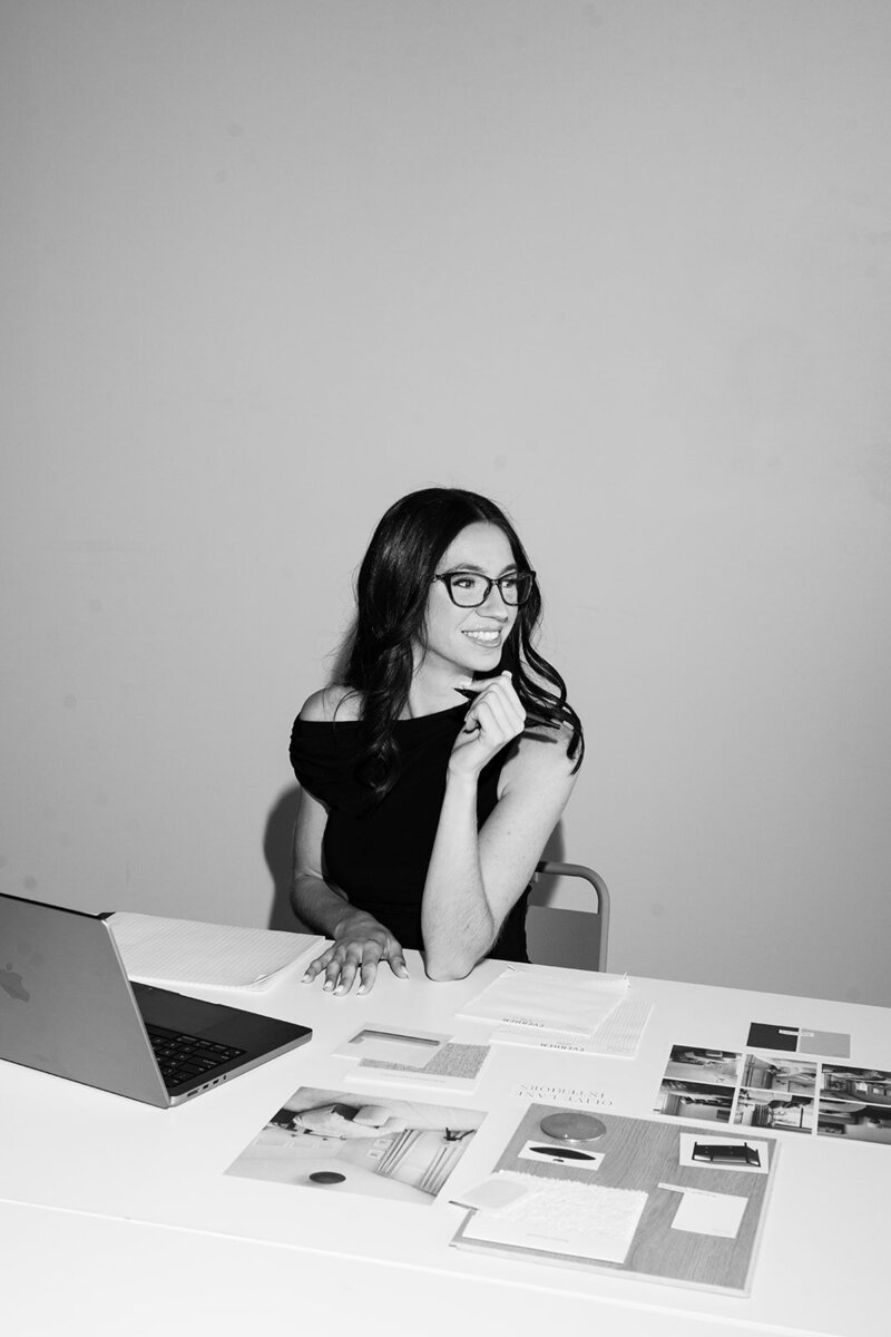 Interior design consultant reviewing plans at workspace